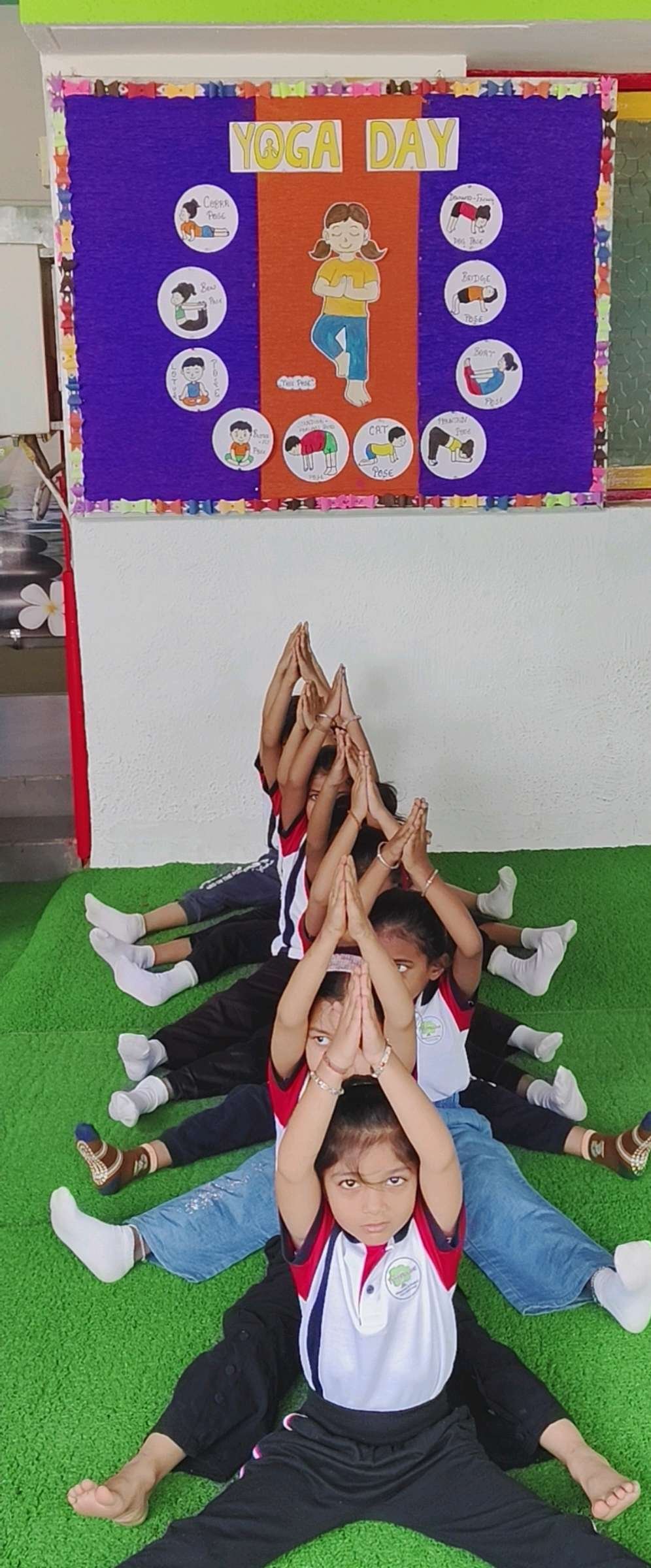 Nikol children practising yoga and mindfulness together